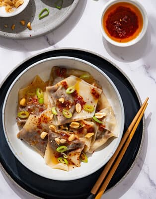 Dumplings with sweet & spicy chili-oil sauce
