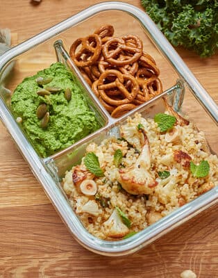 Roasted cauliflower tabbouleh with kale hummus & pumpkin seeds