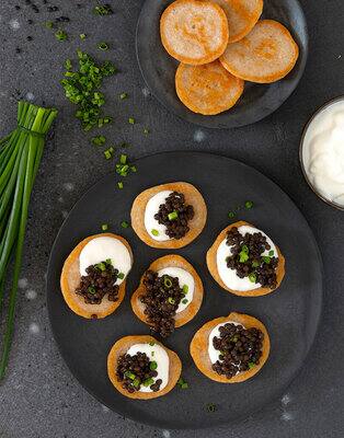 Blinis met beluga linzen