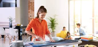 Braun CareStyle Compact – woman ironing