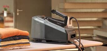 Braun CareStyle 7 Pro Steam generator iron standing on an ironing board.