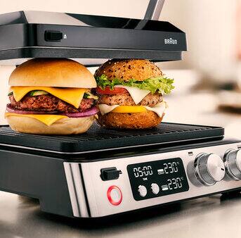 A juicy burger cooking on MultiGrill 7 highlighting a perfect dining experience.