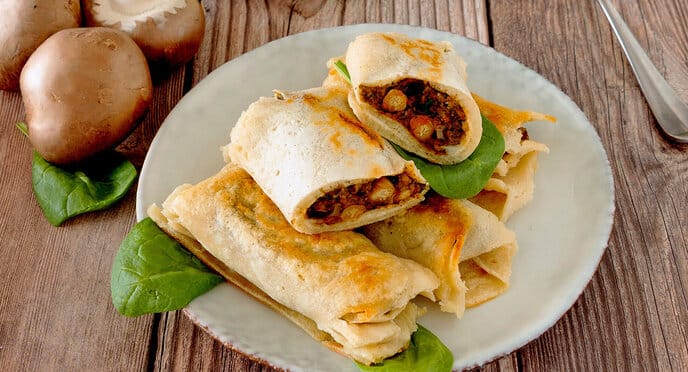 Plate of crepes with mushroom filling